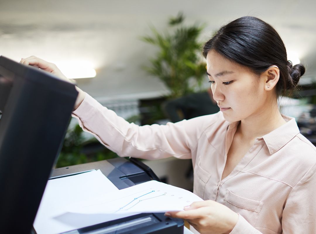 a woman scanning paperwork