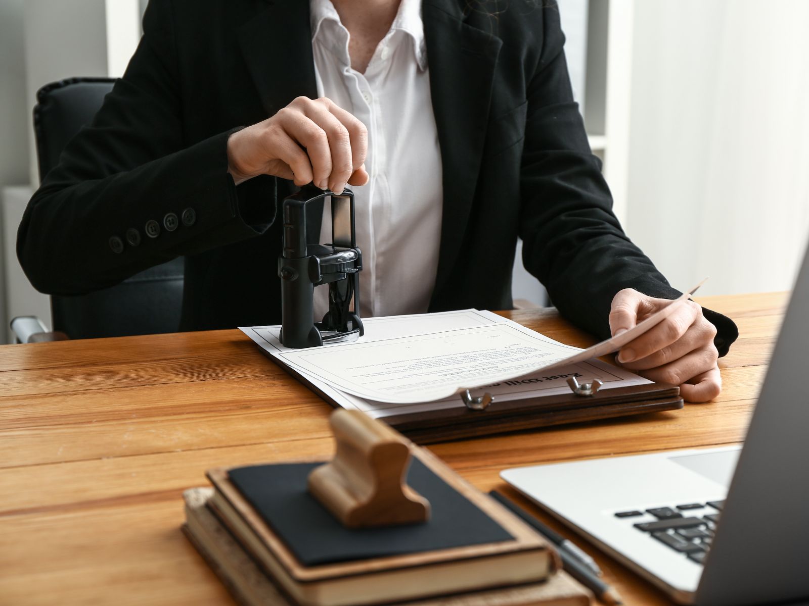 a person stamping documents