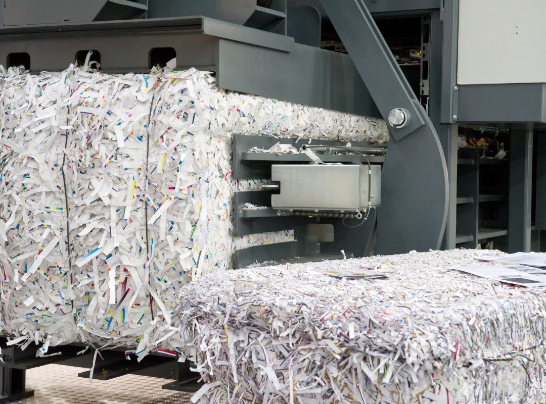 large machines bundling shredded papers