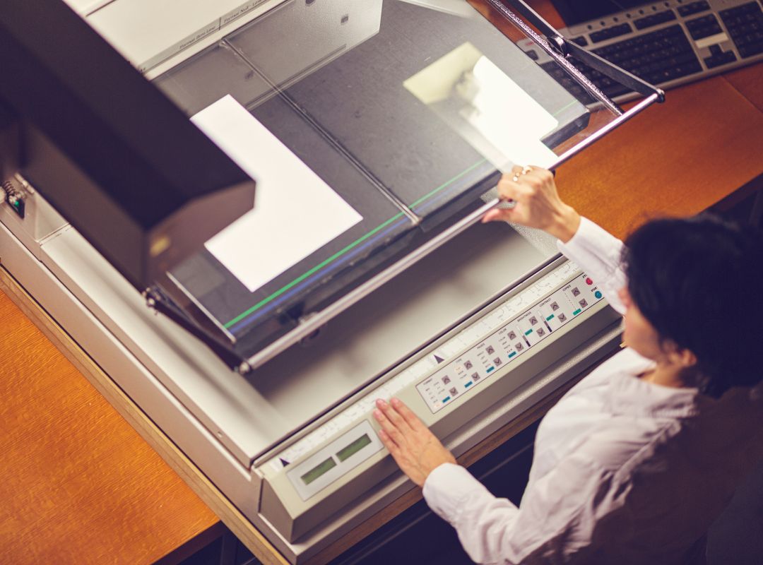 a large scanner being used to scan papers